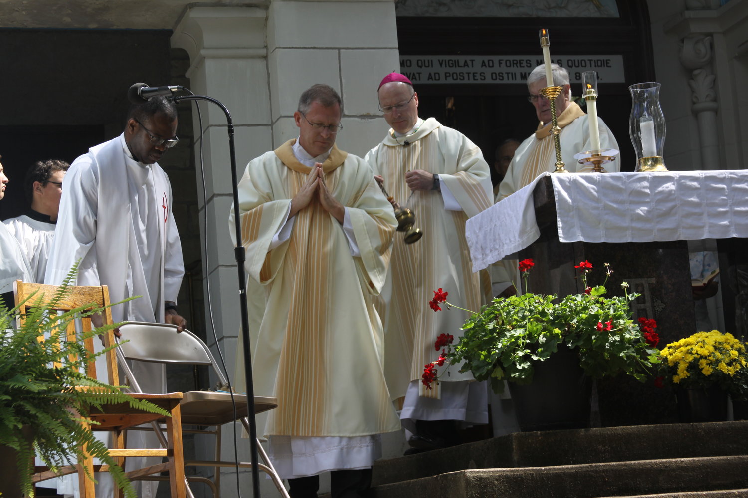 Bishop W. Shawn McKnight incenses the altar during Mass on Sept. 11 at the outdoor altar of the Shrine of Our Lady of Sorrows in Starkenburg.